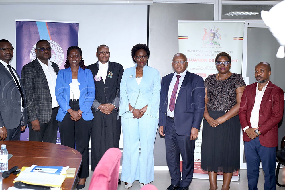 Minister of Lands, Housing and Urban Development Judith Nabakooba (5th left) poses with some of the new land sector regulatory bodies. This was during the swearing-in ceremony held on October 2, 2026. (Photo by Alfred Ochwo)
