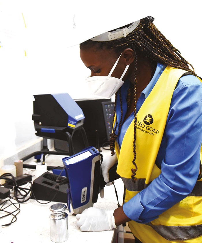 A lady testing mineral composition at the Euro Gold Refinery in Kamwokya, Kampala