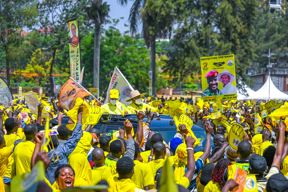 President Yoweri Kaguta Museveni accompanied by the First Lady and Minister of Education and Sports, Maama Janet Museveni, greet NRM supporters upon arrival for the campaign rally. (Credit: PPU)