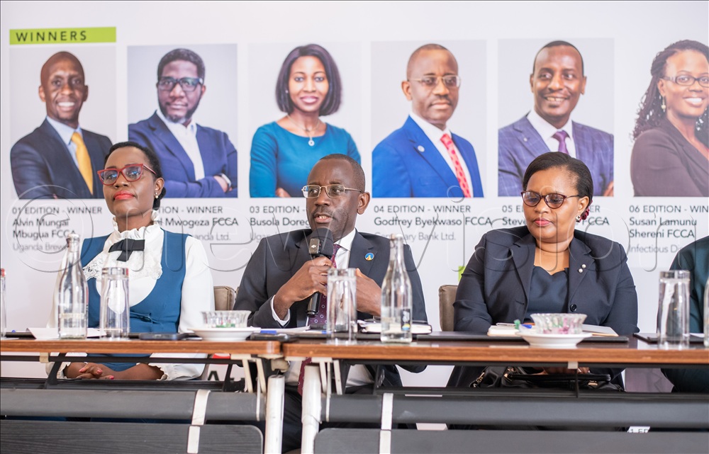(L-R); Irene Mwoyogwona, executive director at BRAC, Godfrey Byekwaso, managing director, Centenary Bank and a past winner of the CFO Awards and Charlotte Kukunda, country manager at ACCA Uganda during the press launch event at Golden Tulip Hotel in Kampala.