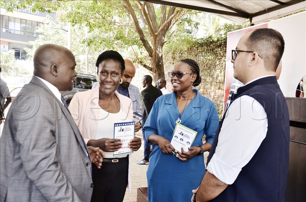 The director for housing in the Ministry of Lands, Housing and Urban Development, Dave Khayangayanga (left) chatting with the director of Exhibition Organisation and Promotion Company, Vijayanka Brighuvanshi (right) during a press conference in preparation for the 5th Uganda Buildcon International Expo at Media Center Kampala on July 30 2026.