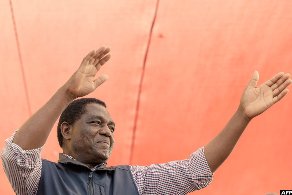 Zambian incumbent President and UPND presidential candidate Hakainde Hichilema waves at supporters at an election campaign rally in Lusaka on August 11, 2026