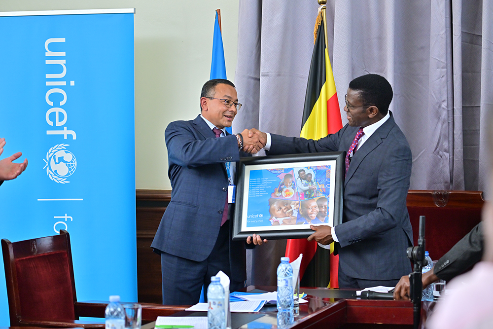 Dr Robin Nandy, the UNICEF Representative to Uganda (left) shaking hands with Charles Peter Mayiga, Katikkiro (Prime Minister) of the Kingdom of Buganda. (Courtesy)