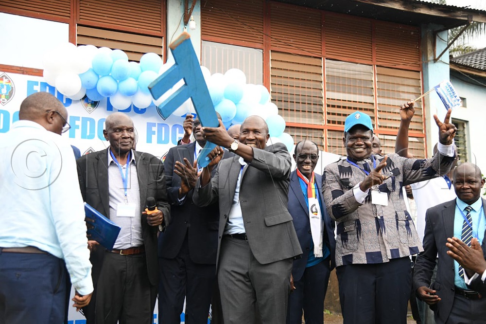 Nandala Mafabi holding the Key which is the party's election symbol. (Credit: Maria Wamala)