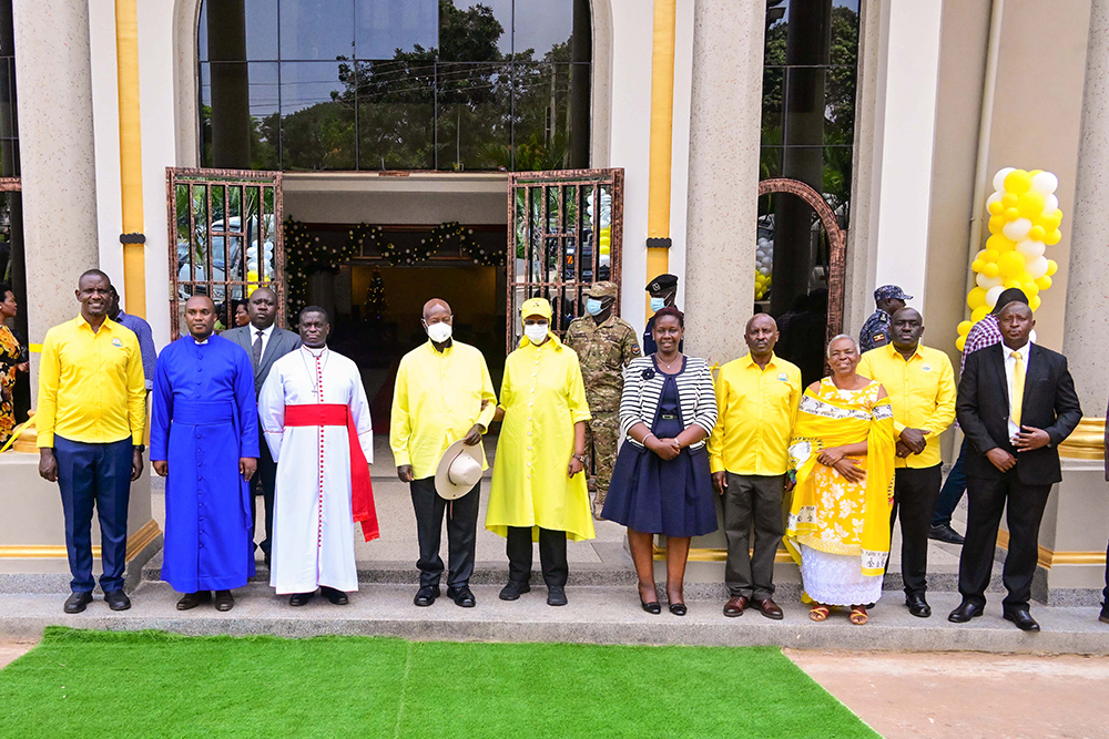 President Museveni and First Lady Janet Museveni (C) pose for a photo with the clergy and members of St. John's Church Entebbe during its commissioning on Monday. 
