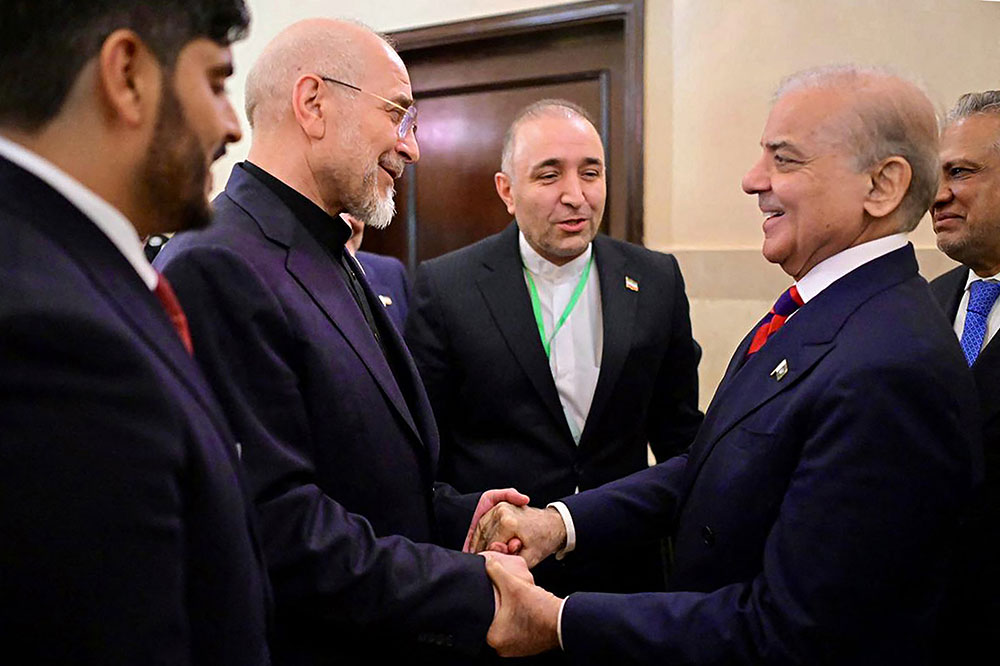 Pakistan's Prime Minister Shehbaz Sharif (2R) with Foreign Minister Ishaq Dar (R) greeting Iran's parliamentary speaker Mohammad Bagher Ghalibaf (2L) during their meeting prior to the US-Iran peace talks in Islamabad on April 11, 2026. (AFP/Pakistan's Prime Minister Office)
