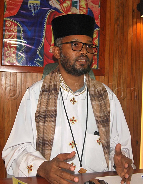 Priest Siyuman Binian. (Credit: Benjamin Semwanga)