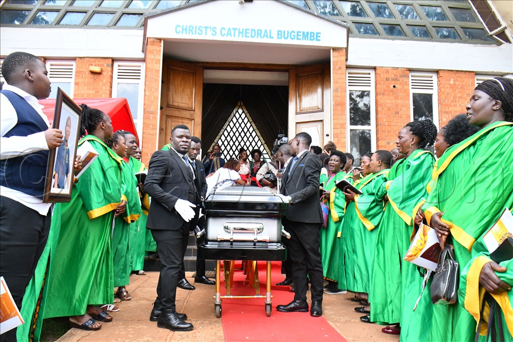 The casket containing remains of the late Mzee William Kyeyamwa being rolled out of Christ's Cathedral Bugembe after a church service on Wednesday.