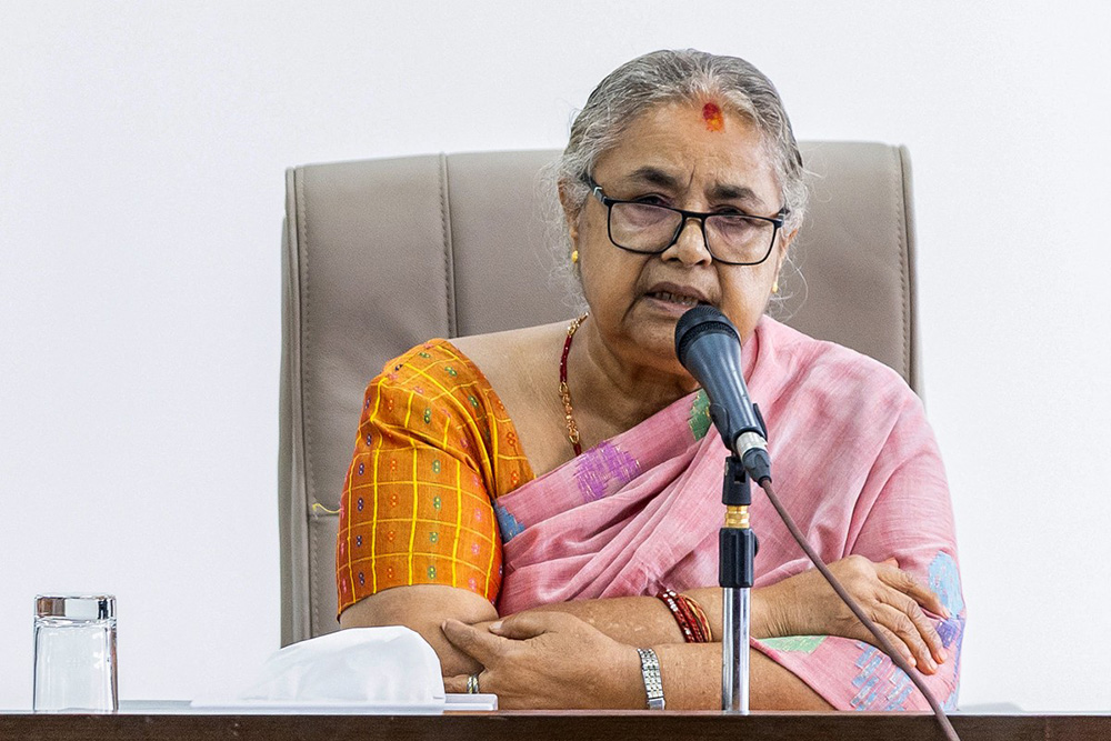 Newly-elected Prime Minister of Nepal's interim government Sushila Karki speaks with officials at the prime minister's office in Kathmandu on September 14, 2025. (Photo by PRABIN RANABHAT / AFP)