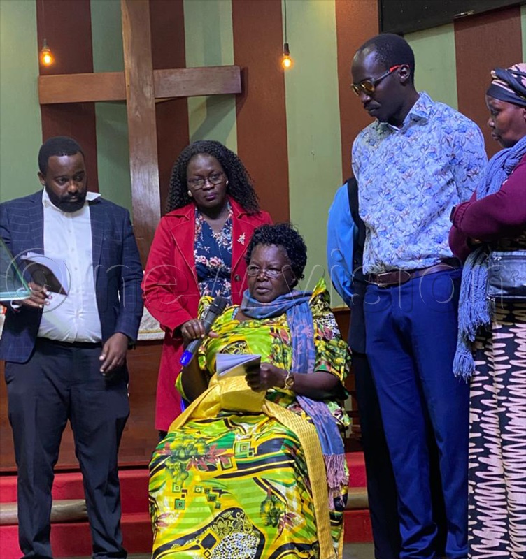 Jacinta Adoch Otto, the deceased&rsquo;s mother pays her tribute, with her are other family members.