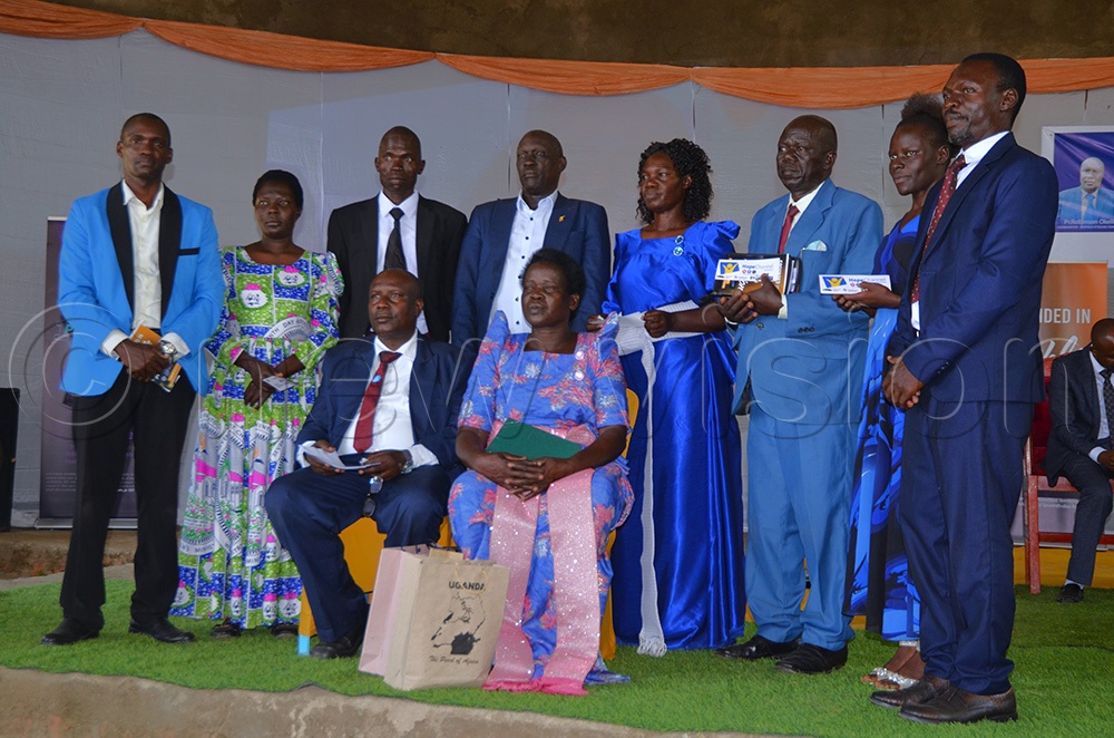 Pr Robinson Okello, the New coordinator of SDA West Nile Territory poses for a group photo with his new executive. (Photo by John Paul Opio)