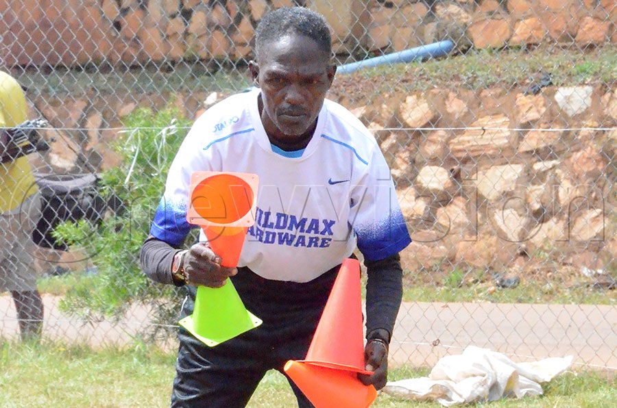 Obadiah Ssemakula works out with children of Motherwell Soccer Academy in Mutungo in 2019. Photo by Michael Nsubuga