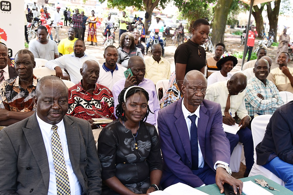 RCC Soroti City, Michael Okurut, with Eveline Ejalu from civil society and Soroti district inspector John Okiror. (Credit: Godfrey Ojore)