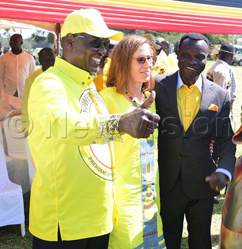 Captain Mike Mukula poses for a picture with David Calvin Echodu and his American wife. (Credit: Godfrey Ojore)