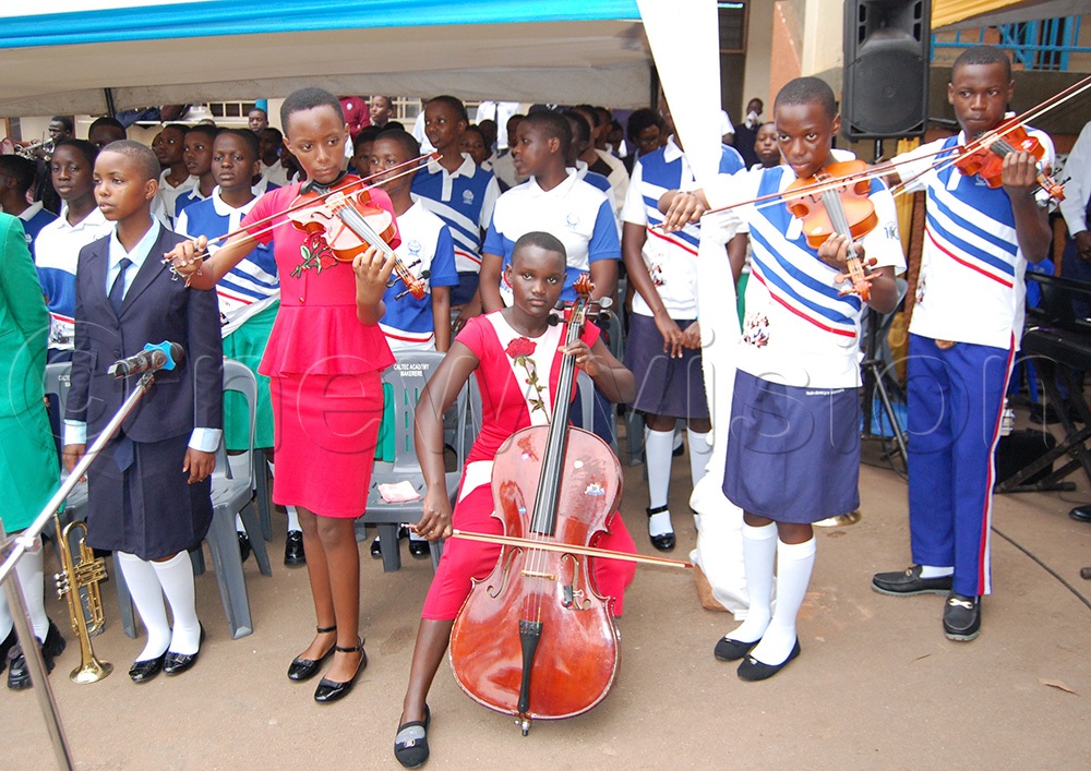An action spectacle of the school choir's string section during mass. (Photo by Mathias Mazinga)