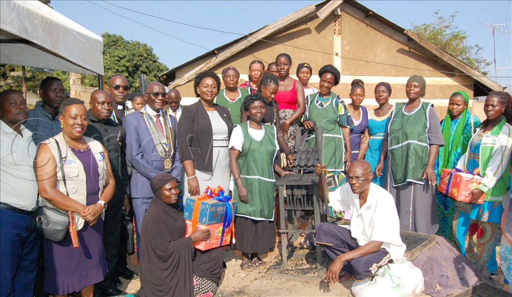 Rotary District Governor Daniel Mukasa Ddamulira (donning rotary medals) and his wife Canon Alice Ddamulira (on his immediate left) share a photo-moment with members of the Rotary Club of Nsambya Premium and the members of Nsambya Environmental Initiative. This was during the Governor's working visit to Mubiru Zone, Nsambya, on Wednesday, July 15, 2026.