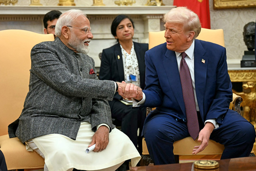 US President Donald Trump (R) shakes hands with Indian Prime Minister Narendra Modi in the Oval Office of the White House in Washington, DC, on February 13, 2025. India is aggressively seeking trade deals to open markets for exporters and soften the blow of steep US tariffs, as efforts to secure an agreement with Washington remain elusive. (Photo by Jim WATSON / AFP)