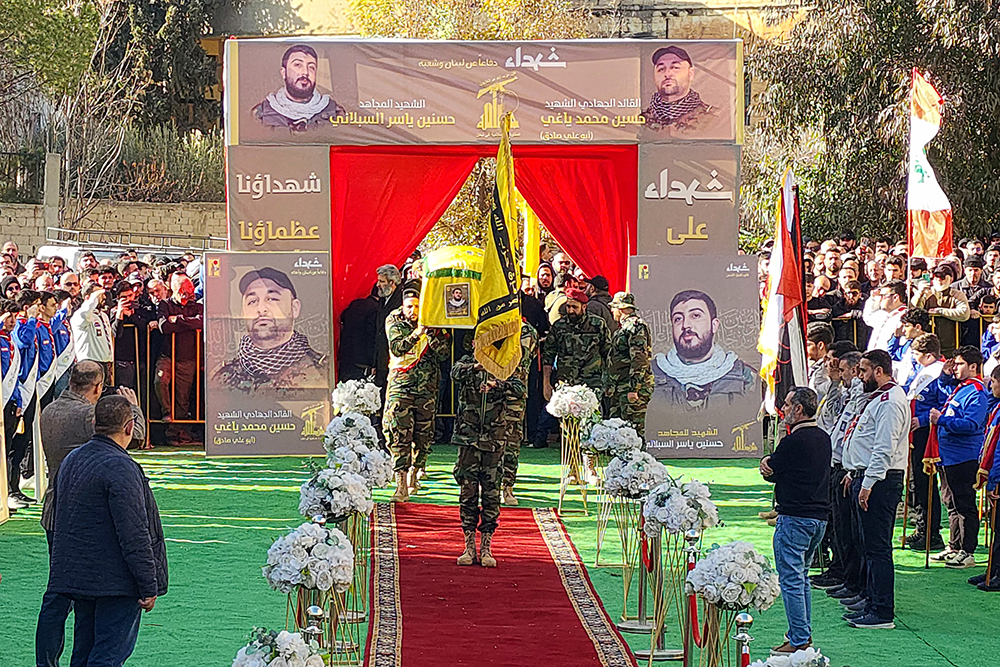 Mourners gather for the funeral of members of the Shiite Muslim Hezbollah party the day after they were killed in an Israeli military strike in the northern city of Baalbek, in the Bekaa valley on February 21, 2026. (AFP)