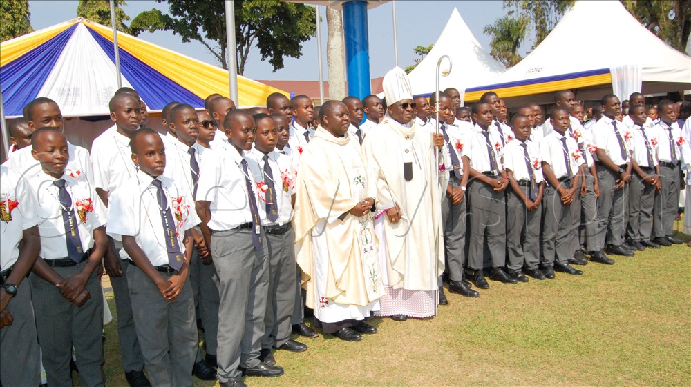 Archbishop Paul Ssemogerere (holding a crosier) shares a photo-moment with the students of SMACK during a recent function.