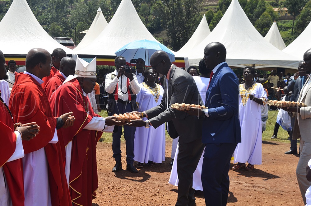 Bishop Callist Rubaramira of Kabale Diocese receiving gifts from Christians during the inauguration of Karujanga parish on Sunday. (Photo by Job Namanya)