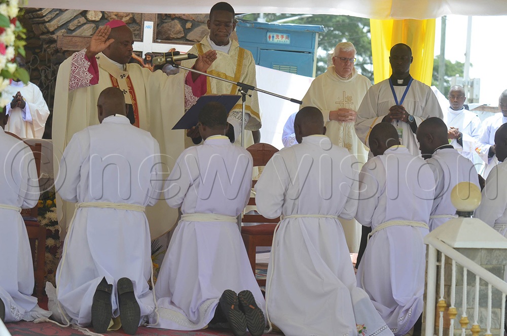 The Archbishop of Mbarara Archdiocese, His Grace Lambert Bainomugisha blessing the newly ordained deacons during the ordination ceremony which took place on Saturday at Nyamitanga Cathedral in Mbarara city. (Photo by Abdulkarim Ssengendo)