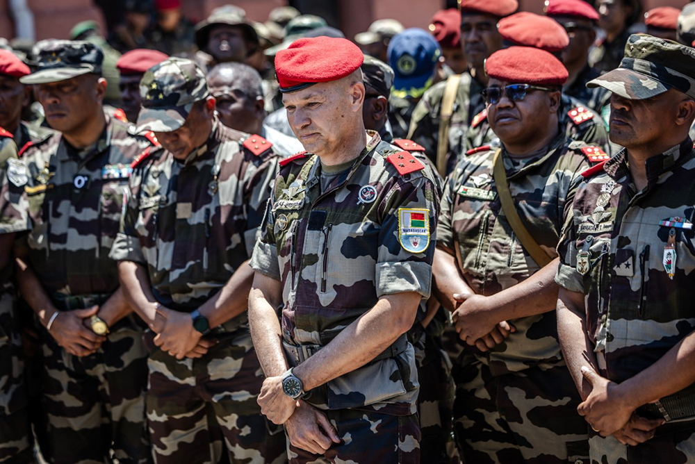 General Demosthene Pikulas (C), declared new head of the Malagasy Army by members of Madagascar’s CAPSAT unit, attends a ceremony in honour of a soldier killed during clashes the previous day at their base in Antananarivo, on October 12, 2025. A mutinied army unit declared on October 12, 2025 that it was taking control of all Madagascar military forces as President Andry Rajoelina said an "attempt to seize power illegally" was under way.The CAPSAT contingent of administrative and technical officers joined thousands of protesters in the city centre on October 11, 2025 in a major shift in a more than two-week anti-government protest movement. 