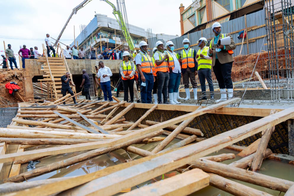 Kiggundu and MPs conducting a guided tour of the redevelopment of the Nakivubo drainage channel. (Courtesy)