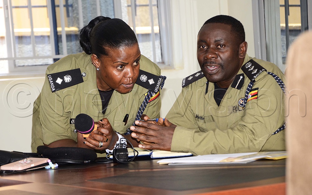 Dr Aisha Kayongo interacts with Alex Mwine, Senior Superintendent of Police under the department of planning and quality control during the stakeholder’s consultative workshop at the Police headquarters in Naguru. (Photo by Juliet Kasirye)