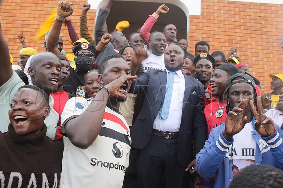 Kiyaga, with his enthusiastic supporters, after court