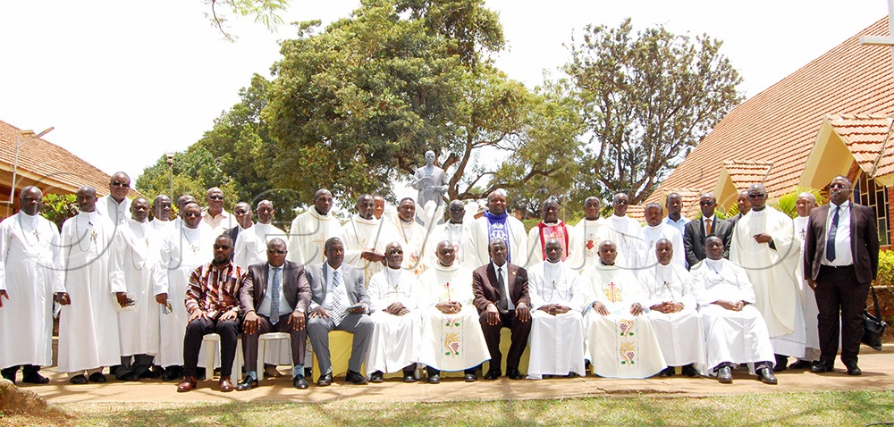 Catholic priests concelebrated mass sharing a photo-moment with some of the Brothers of Christian Instruction and guests who graced the launching of the celebration of the 100th anniversary of the advent of the Brothers in Uganda. (Photo by Mathias Mazinga)