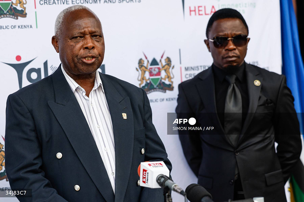 Athletics Kenya President Jackson Tuwei (L), flanked by Kenyan cabinet secretary for Youth Affairs, Sports and the Arts, Ababu Namwamba, briefs the press following the death of world marathon record-holder Kelvin Kiptum, at his office in Nairobi on February 12, 2024.