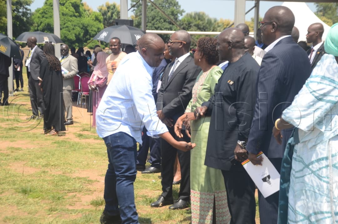 Minister for Local Government Balaam Barugahara greets mourners as he arrives at Paridi Stadium for Gen. (Rtd) Moses Ali&rsquo;s state funeral.
