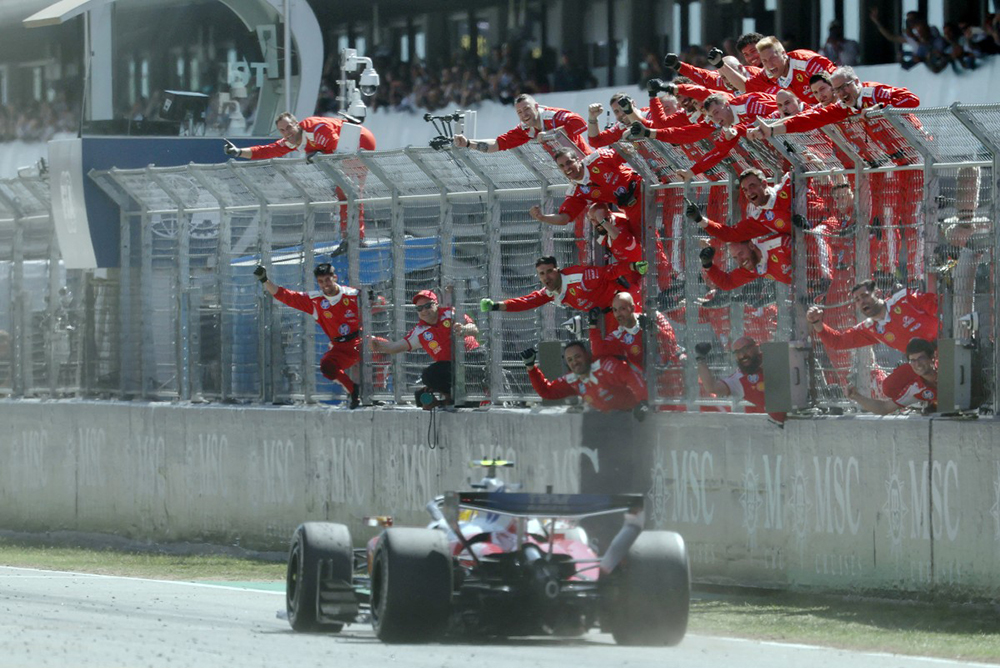 Ferrari team members celebrate Ferrari's British driver Lewis Hamilton's victory in the Catalonia Formula One Grand Prix at the Circuit de Catalunya in Montmelo, on the outskirts of Barcelona, on June 14, 2026. 
