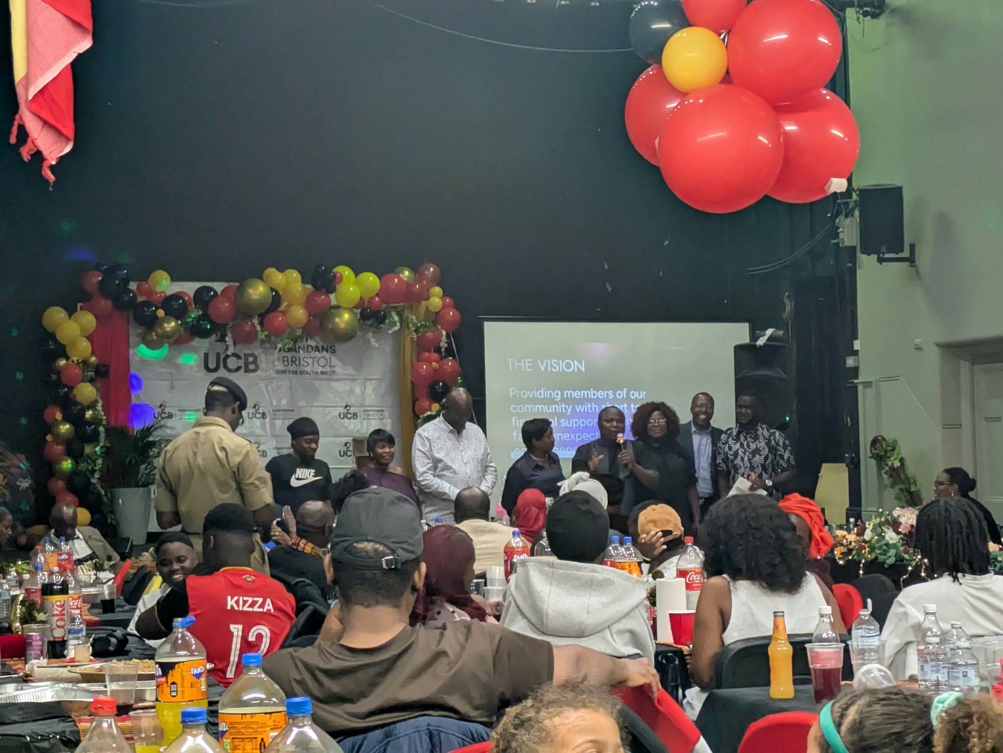 Ugandans in Bristol listening to speeches.