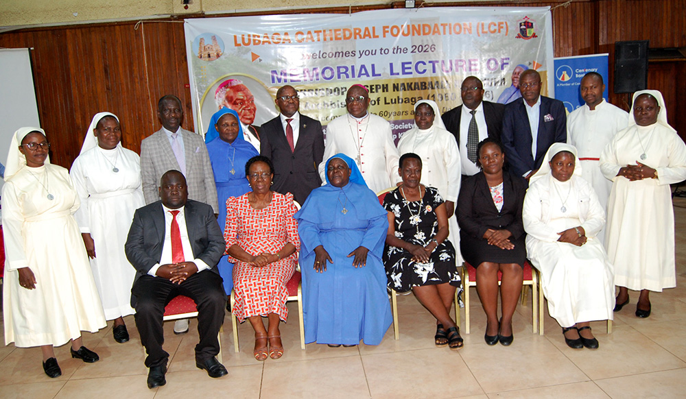 Archbishop Paul Ssemogerere (wearing a skull-cap) shares a photo moment with the Chief Guest Dr. Fabian Kasi (on the archbishop's immediate right), Catholic nuns and some members of Lubaga Cathedral National Foundation. (Photo by Mathias Mazinga)