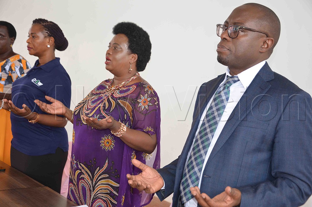 (R-L) Ssengendo, minister Amongi and Dr Diana joining the women in singing the Lango Anthem during the launch at Coronation Park in Lira City on Monday. (Credit: Patrick Okino)