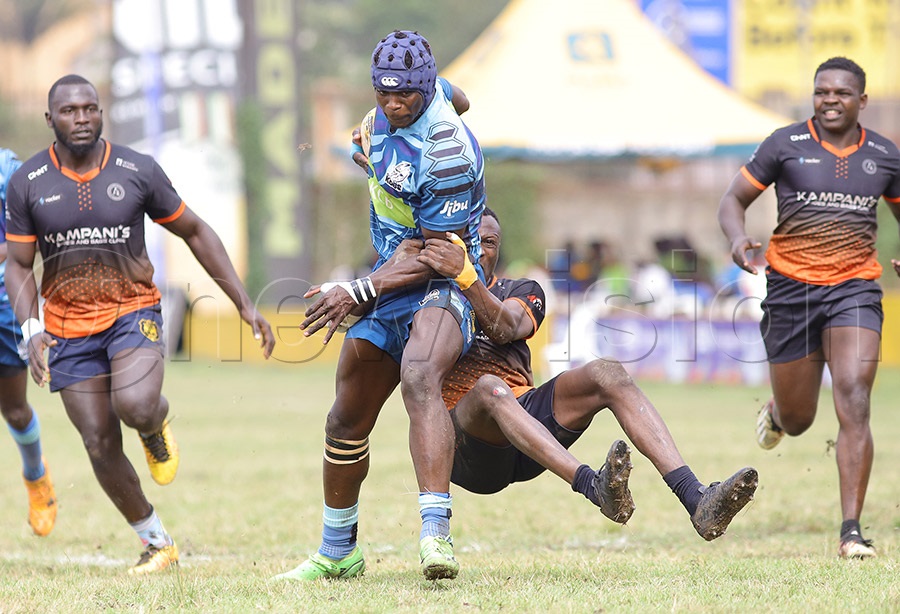 KCB Kobs' Brian Wandera is tackled by a Kampani Eagles player during the Kyadondo 7s. PHOTO: Johnson Were