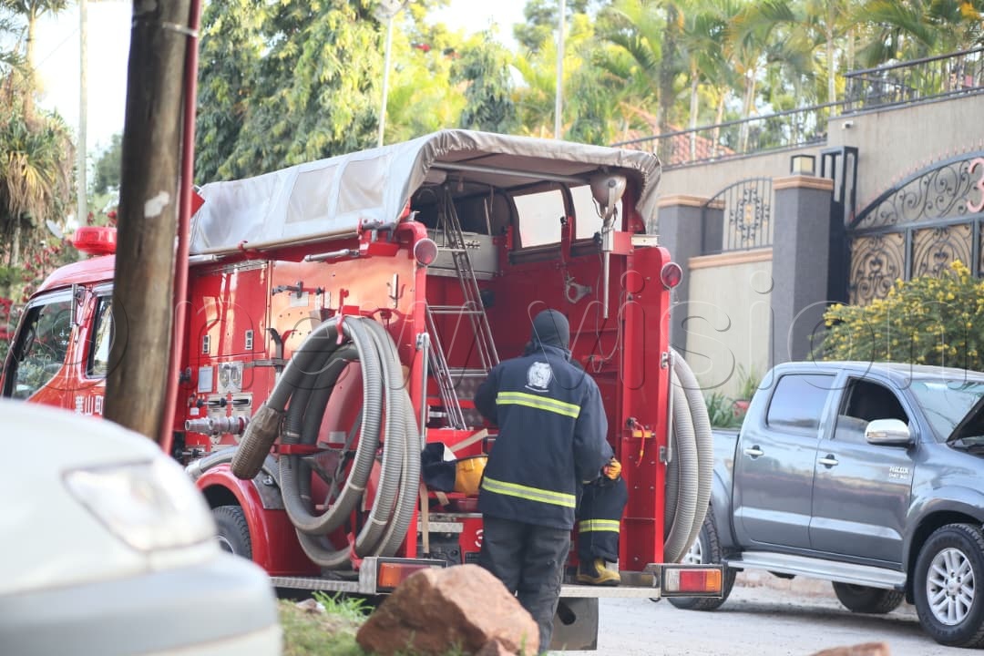A police fire brigade is in place to aid in the search at Among's residence.