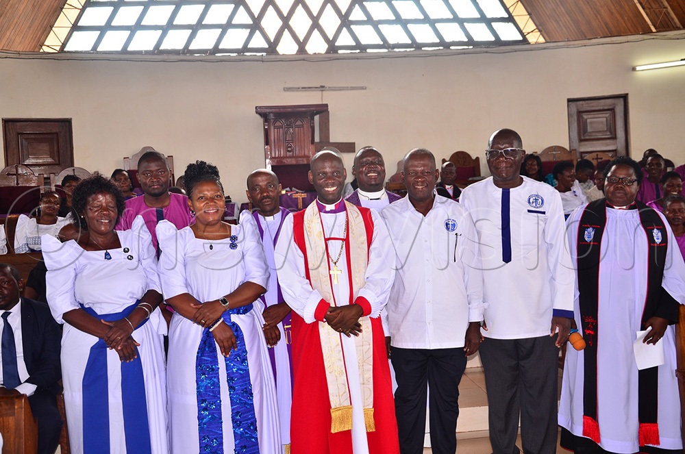 Bishop Grace Lubaale in a group photograph with some members of the Parish council committee at his maiden service which he led at Christ's Cathedral Bugembe in Jinja northern city division on Sunday. (Photo by Jackie Nambogga)