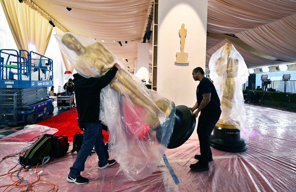 Oscars statues are placed in position as preparations continue on the red carpet on March 8, 2024, in Hollywood, California, for the 96th Academy Awards on March 10. 