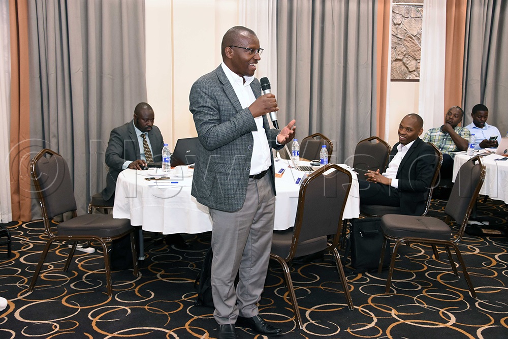 Mugyenyi, deputy executive director of the Advocates Coalition for Development and Environment (ACODE) addressing participants during a stakeholders meeting at Protea Hotel, Kampala. (Photo by John Odyek)