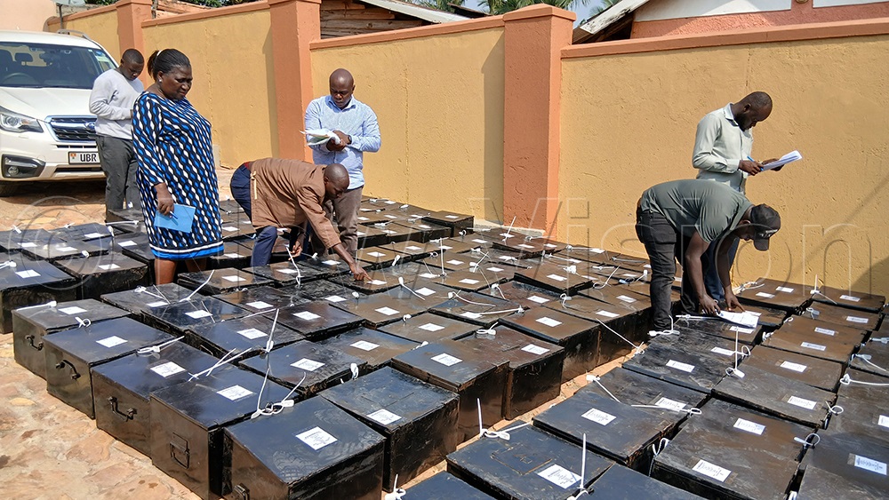 Sheema District electoral officials checking the ballot boxes. (Credit: Bruno Mugizi)
