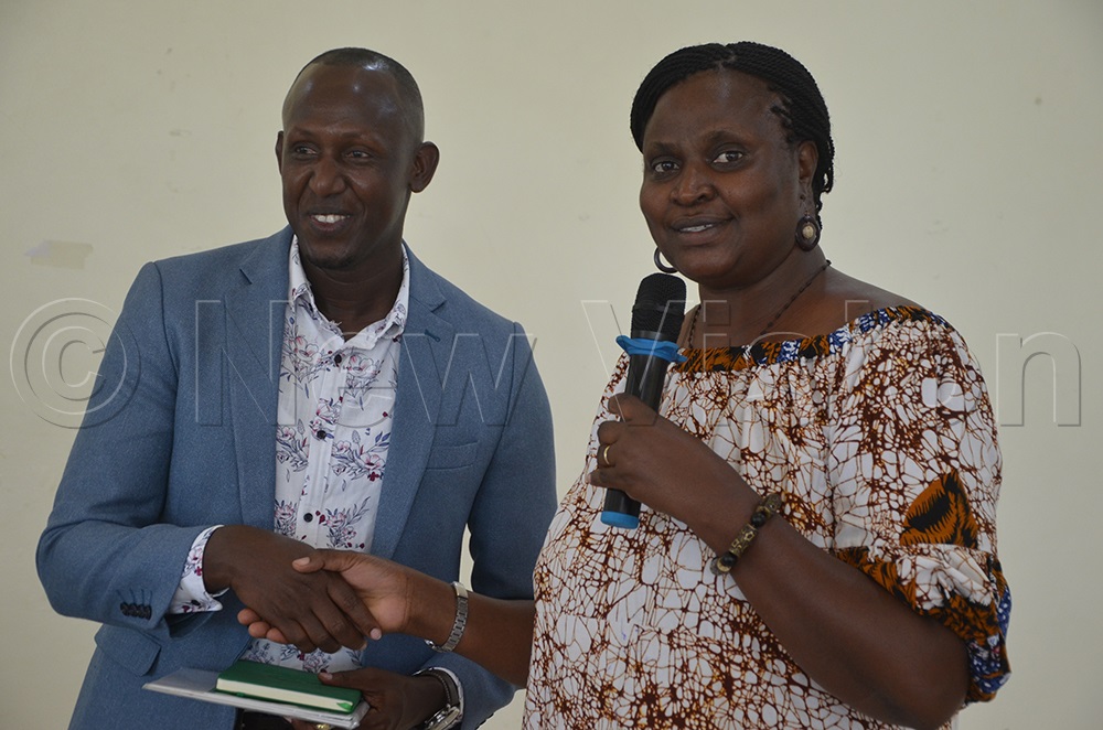 RDC Moroto Bensin Kwikiriza (left) with Joseltyn Bigirwa (right), at the IGAD consultative meeting in Moroto. (Photo by Olandason Wanyama)