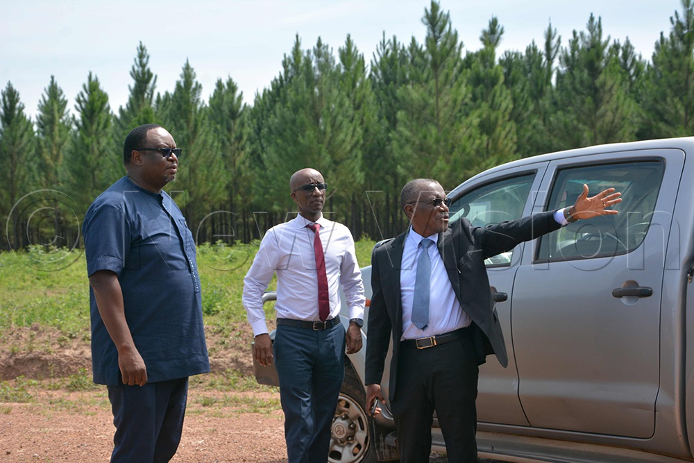 Prof. Samuel Kyamanywa, Chairperson of the University Task Force (right), showing the site where Bunyoro University is going to be constructed to Mumba Kalifungwa, Chief Executive of Stanbic Bank (left). (Photo by Peter Abaanabasazi)