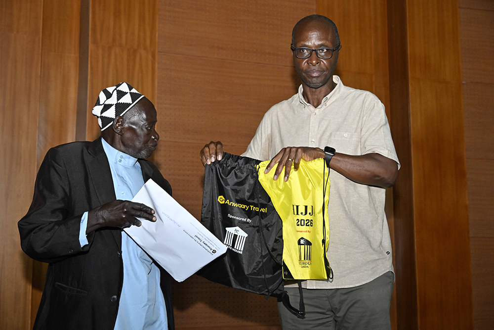 (Left -right) An 85-year-old Kubonubona Jowadu receives his package from the Senior Presidential Advisor on Political Affairs, Moses Byaruhanga, one of the 150 Muslim Pilgrims that Museveni sponsored for this year's Hajj Pilgrimage to Mecca at the President&rsquo;s Office in Kampala on 6th May 2026. 