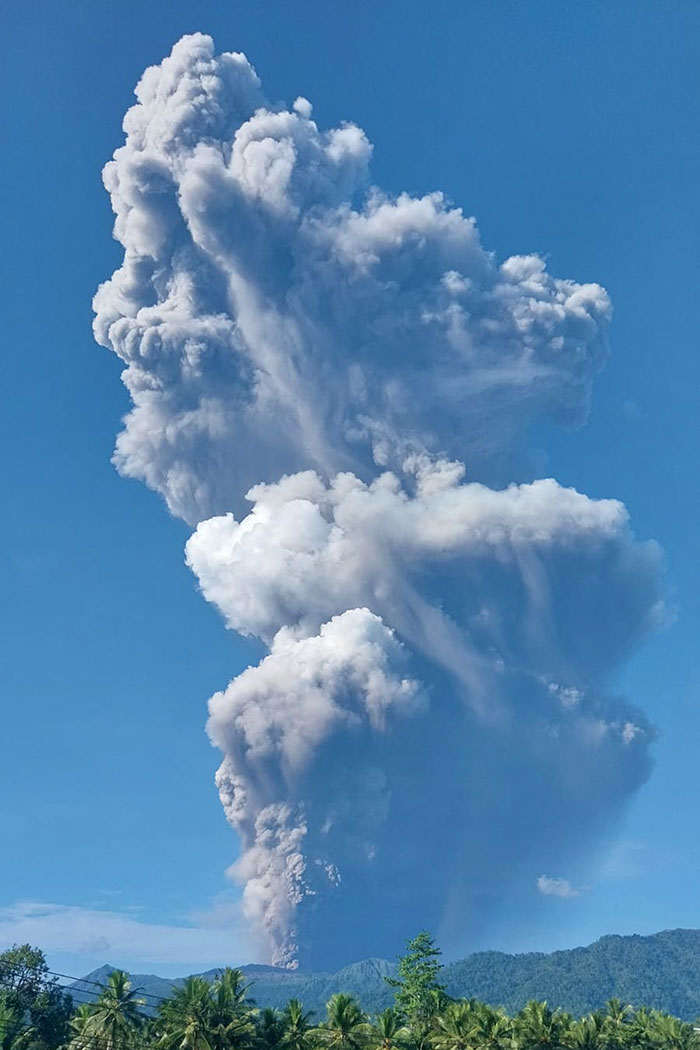Smoke rising from the eruption of Mount Dukono as seen from Tobelo, North Maluku. (AFP/Indonesia's National Search and Rescue Agency)