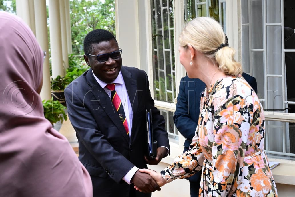 Minister for Justice and Constitutional Affairs, Norbert Mao, greeting the Ambassador of Sweden to Uganda, H.E. Maria H&aring;kansson.