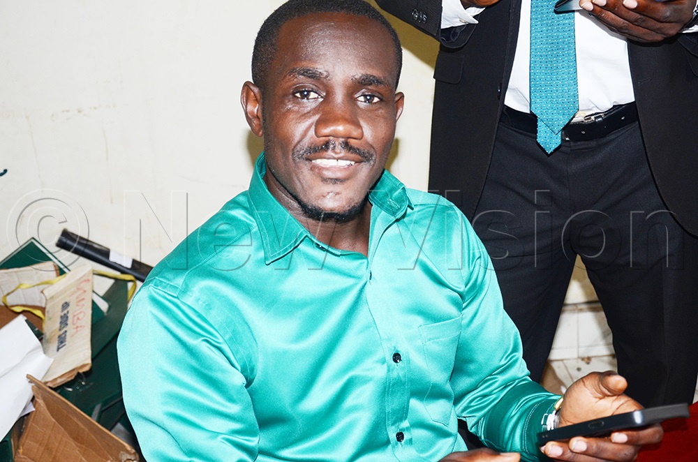 Democratic Party member Julius Dumba jubilate after the expiry of cooperation agreement calling for the party reset ahead of five years. (Photo by Isaac Nuwagaba)