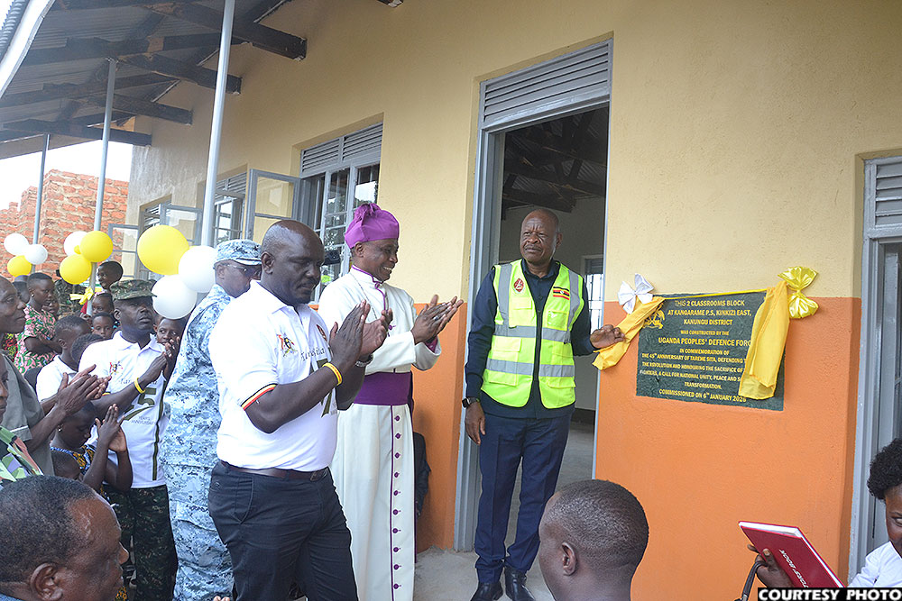 Mbadi commissioning a two-classroom block at Kangarame Primary School.