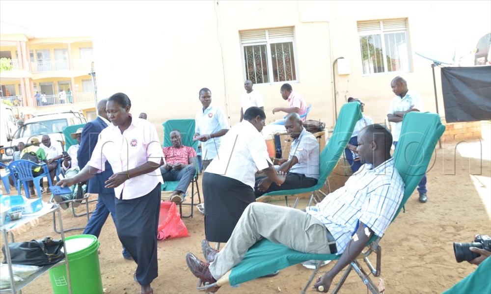 Health workers attending to people during the medical camp.